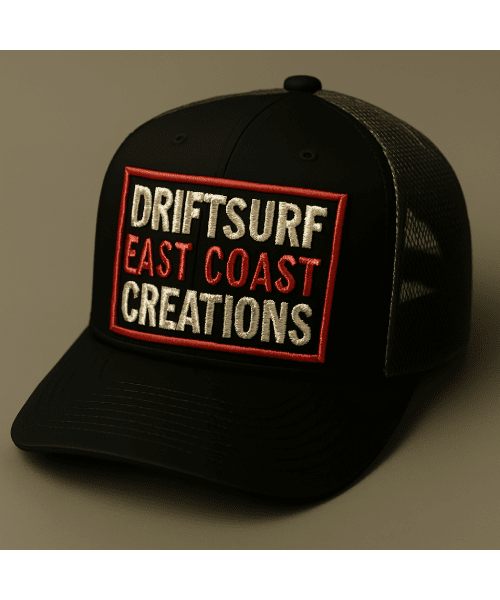 Black trucker hat with a colorful 'Driftsurf East Coast Creations' patch.